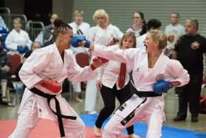 Sensei Dee punching a competitor at a tournament. international women's day 2022 Sensei Dee punching a competitor at a tournament. international women's day 2022
